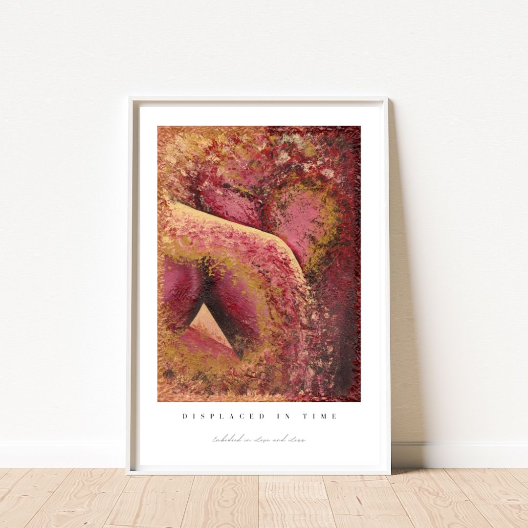 Framed abstract art print with warm colors on a white wall.
