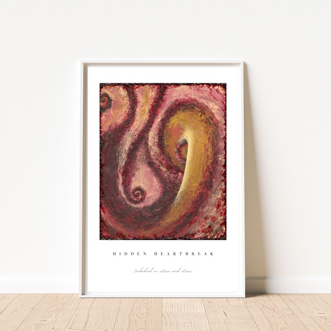 Framed abstract art print with swirling colors on a white wall.