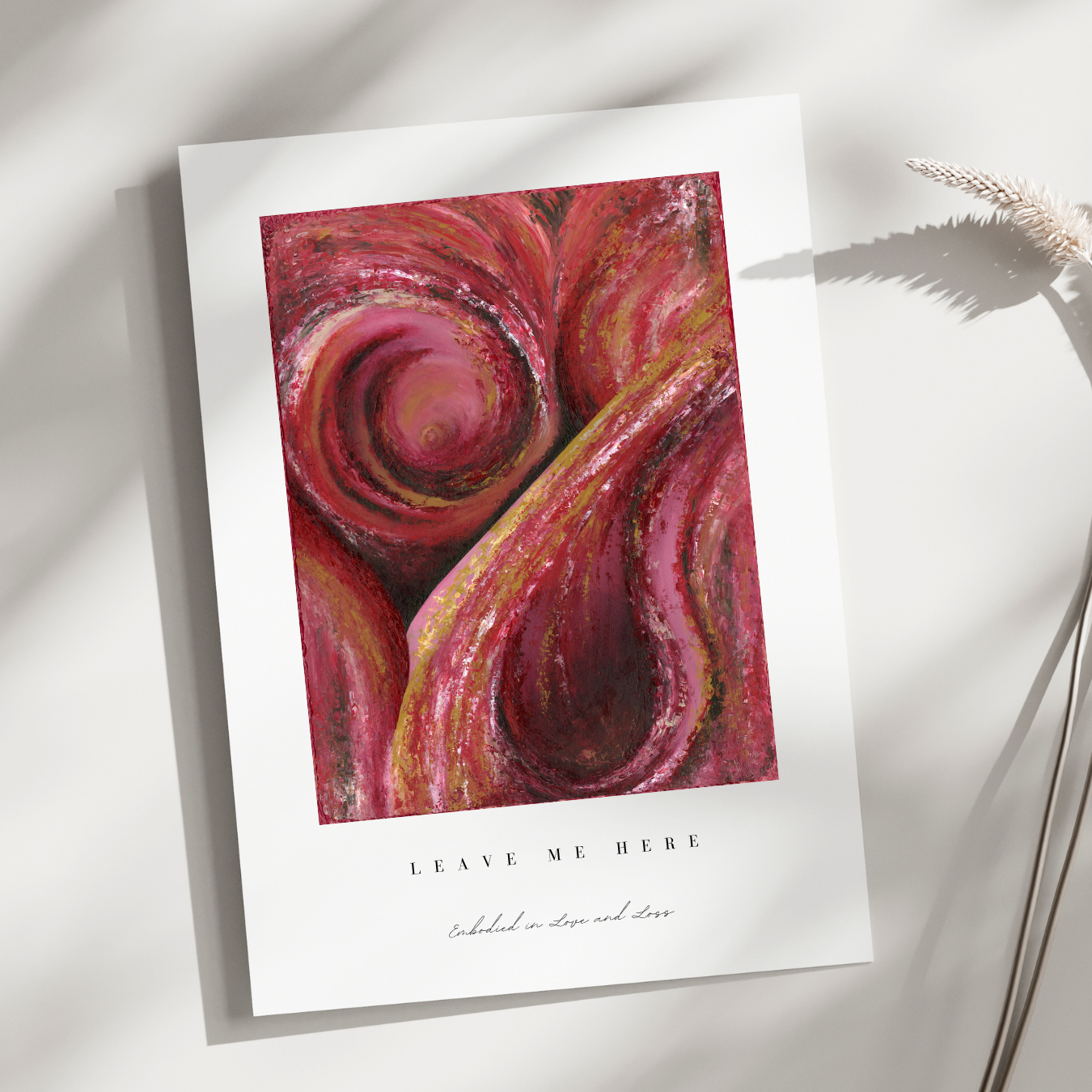 Art print with a swirling red and pink design on a white background