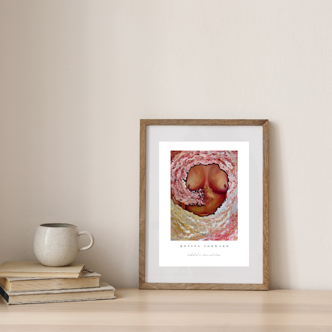 Framed artwork on a wall next to books and a mug
