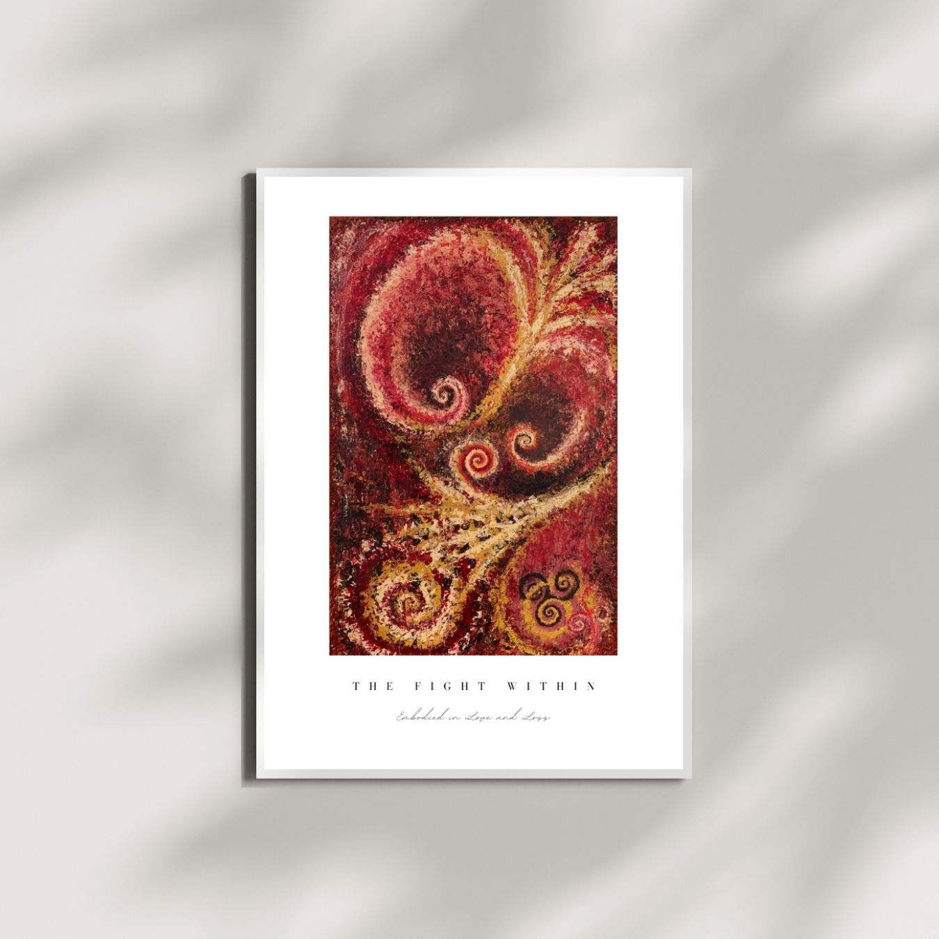 Framed artwork with a red and gold abstract design on a white background