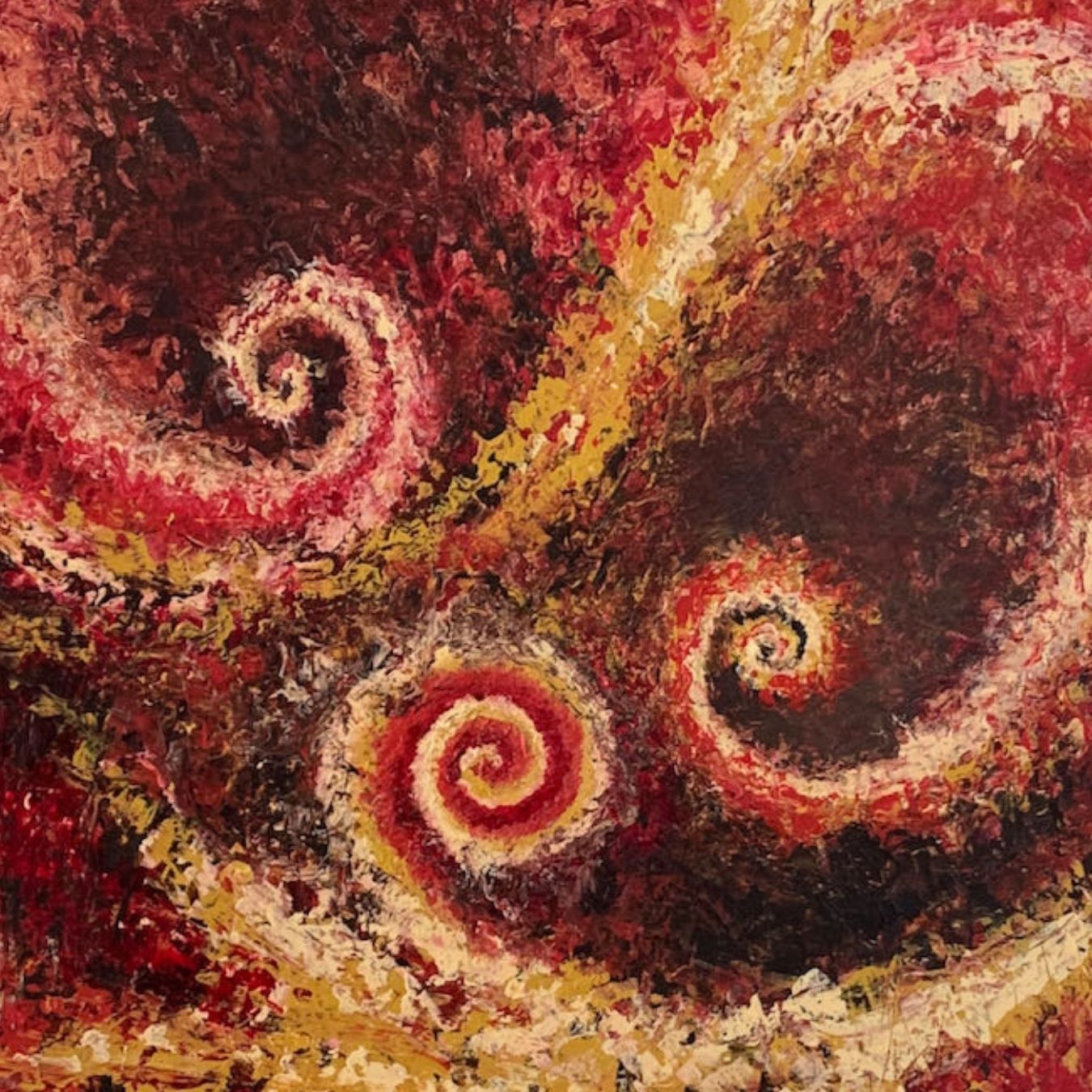 Abstract art with swirling patterns in red, yellow, and brown.