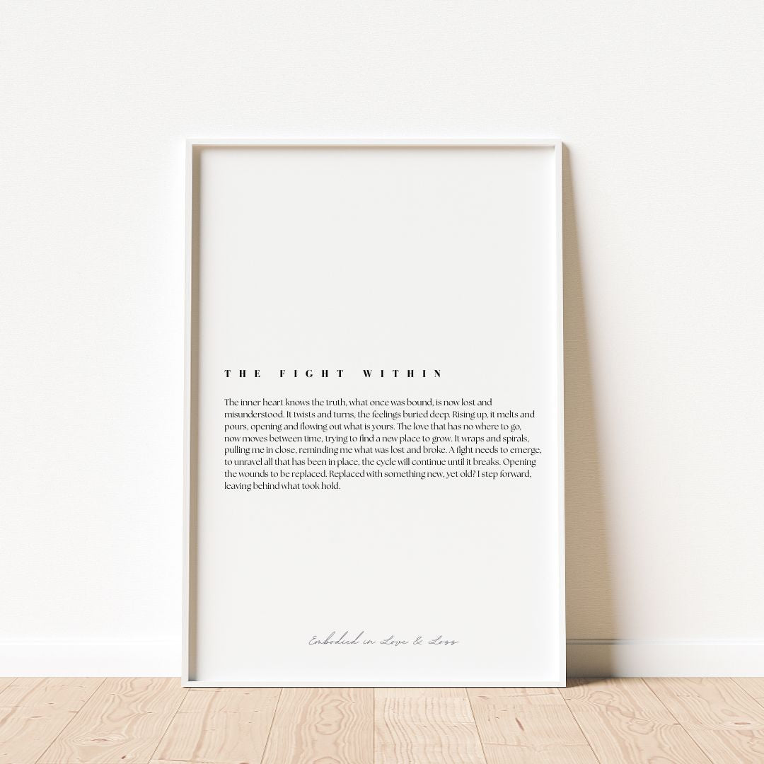 Framed text art print on a white wall with wooden floor