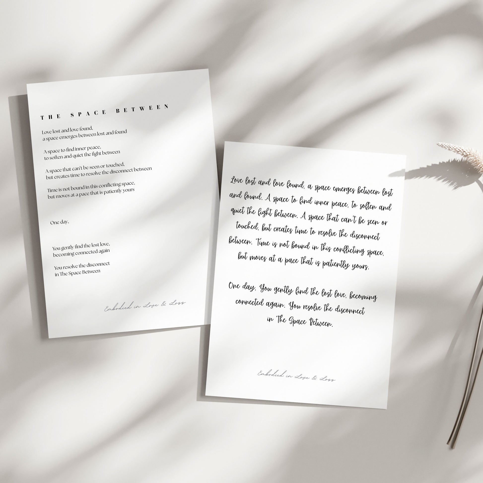 Two sheets of paper with text on a light background