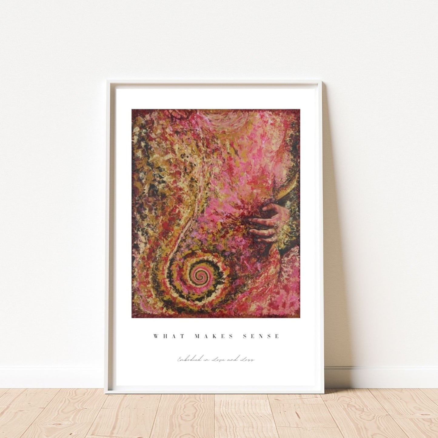 Framed abstract artwork with swirling patterns and text on a white wall.