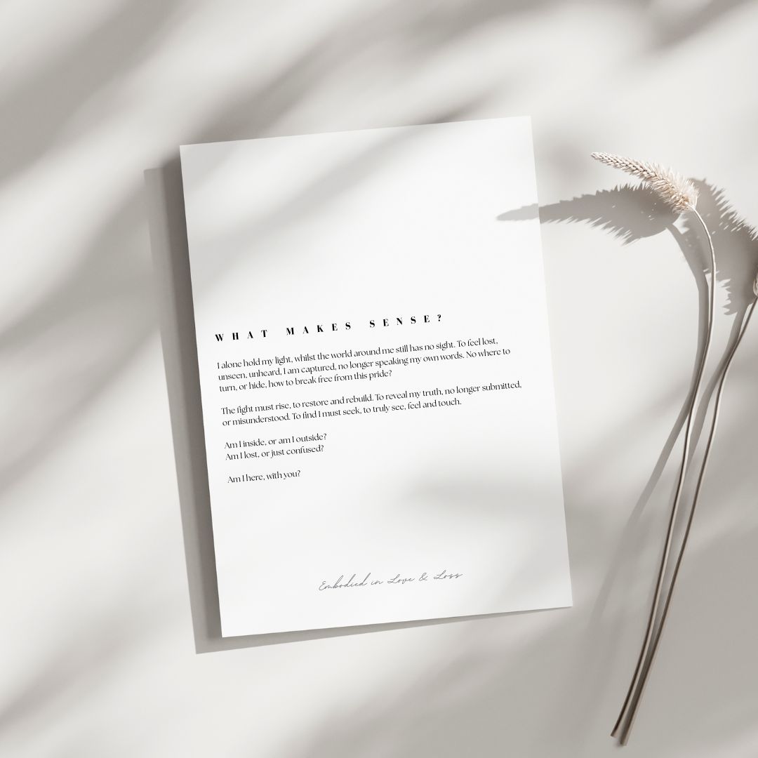 White paper with text on a light background with a plant leaf