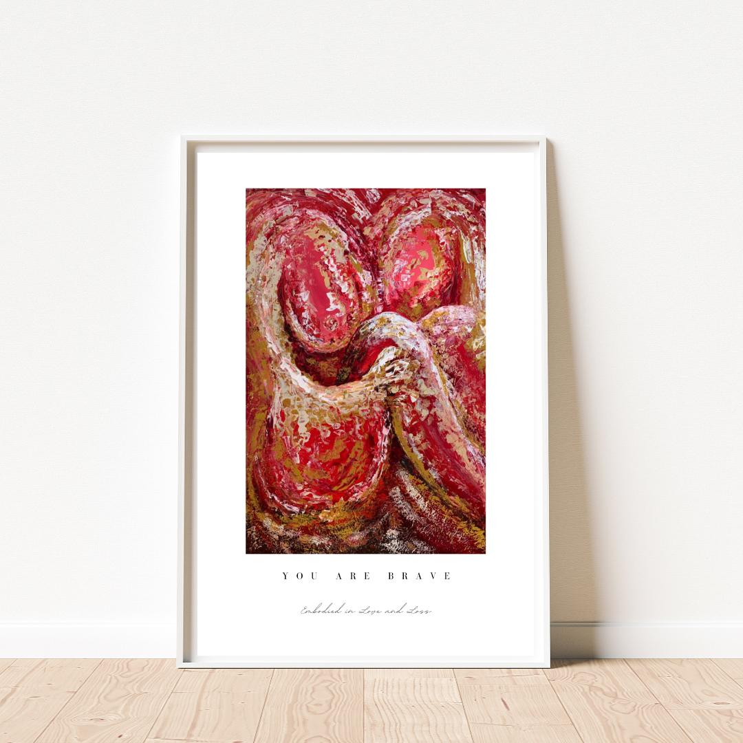 Framed abstract art print with a motivational quote on a white wall.