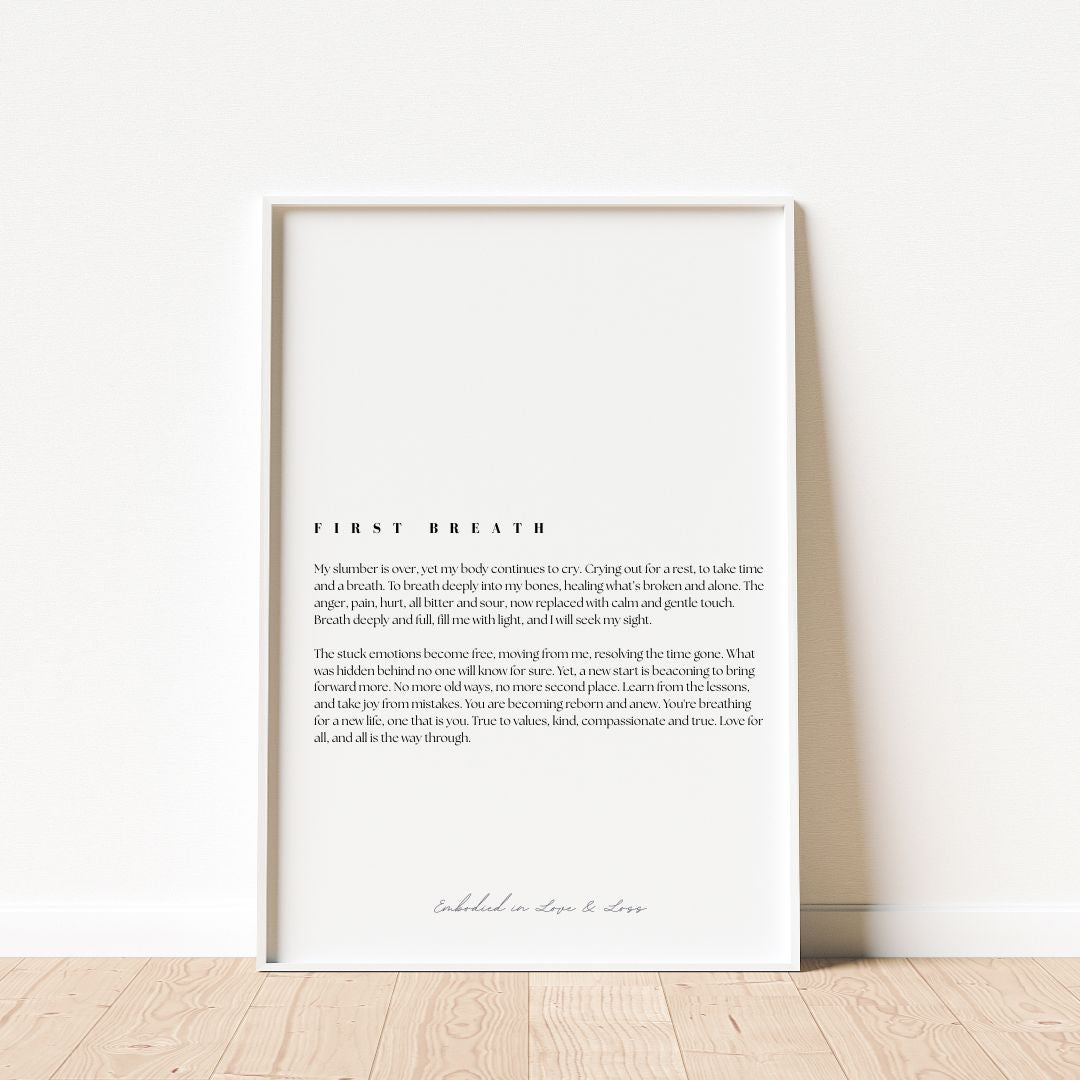 Framed text artwork on a white wall with wooden floor