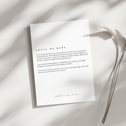 Sheet of paper with text on a light background with dried plants