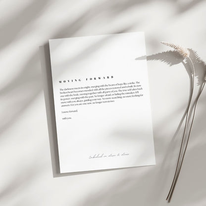 White paper with text on a light background with a dried plant