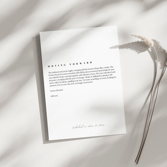 White paper with text on a light background with a dried plant